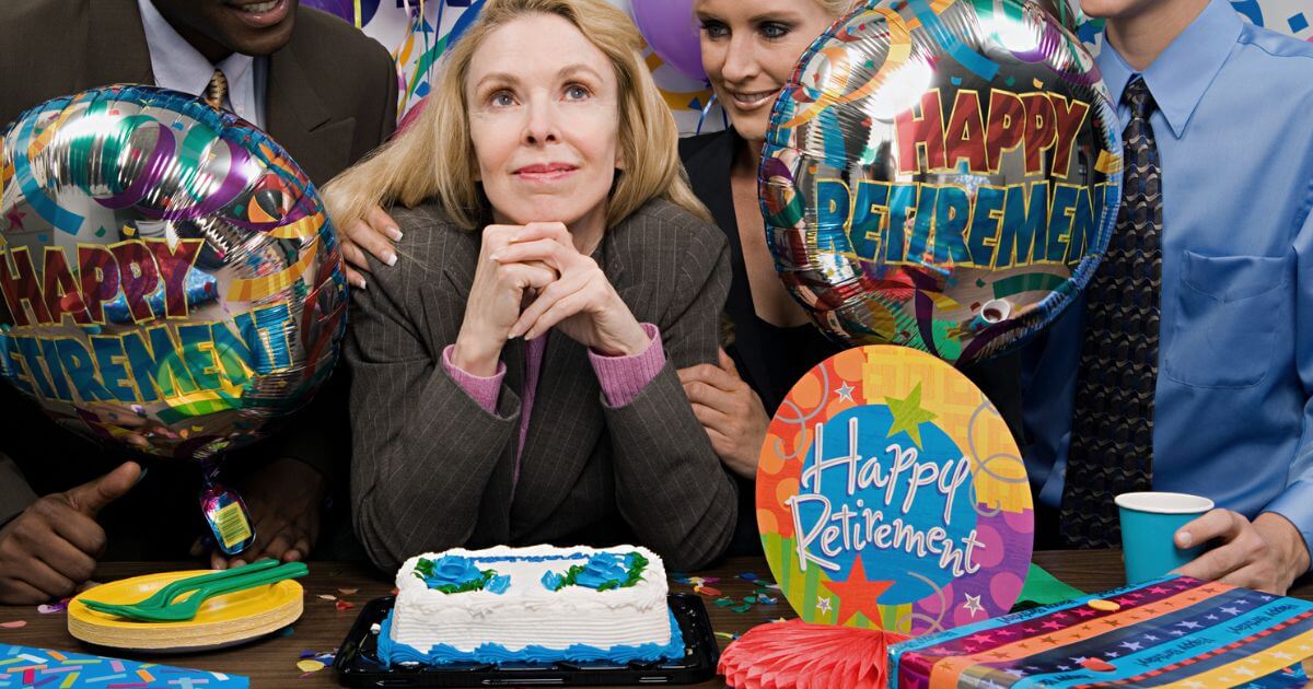 Woman celebrating following her retirement plan with cake and balloons.